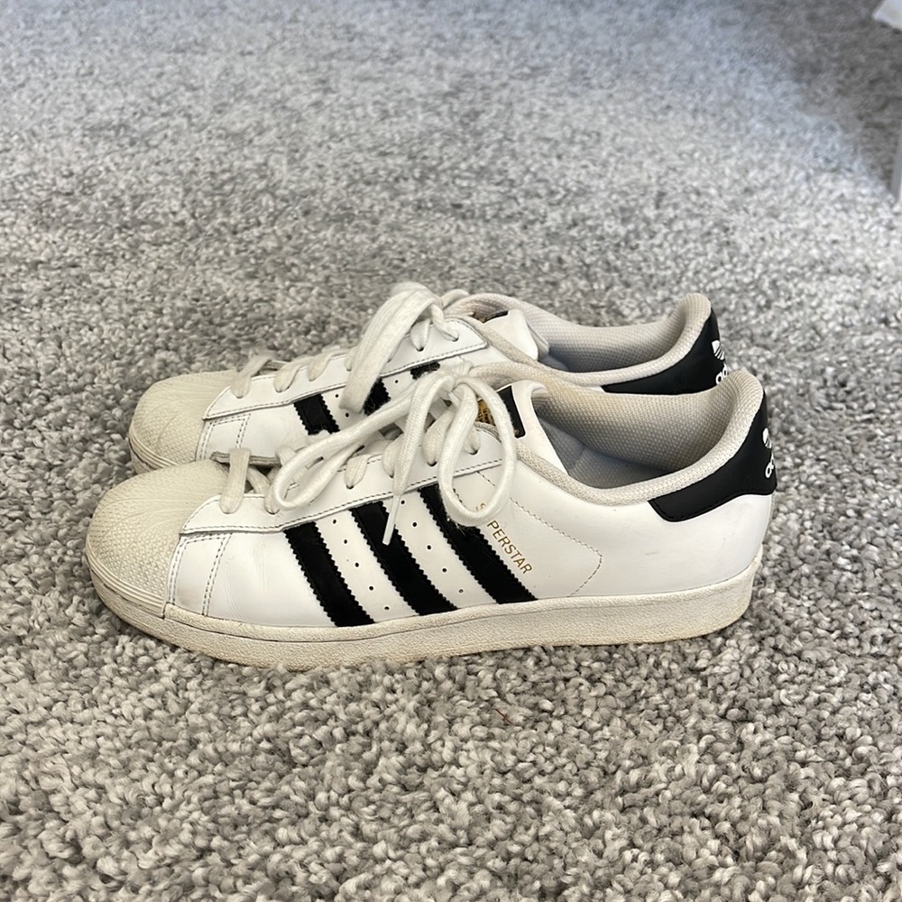 Adidas superstar classic black and white sneaker, size 10. Good condition.